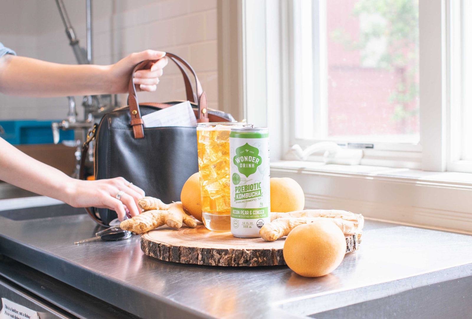 Can of Wonder Drink Kombucha near sink